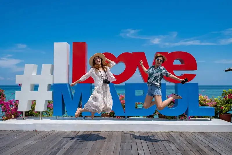 Famous photo spot at the I Love Mabul sign on Mabul Island Grand Dive Resort