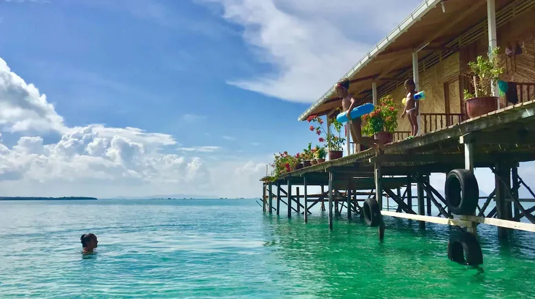 Scenic view of the wooden overwater chalets at the resort Grand Dive Resort