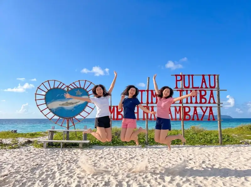 Welcome signboard on the beach at Timba Timba Island Grand Dive Resort